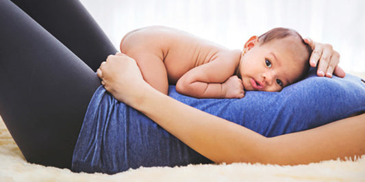 Your first postpartum exercise: A good lie down.